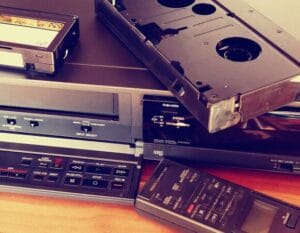 VHS tape and VHS player on a desk